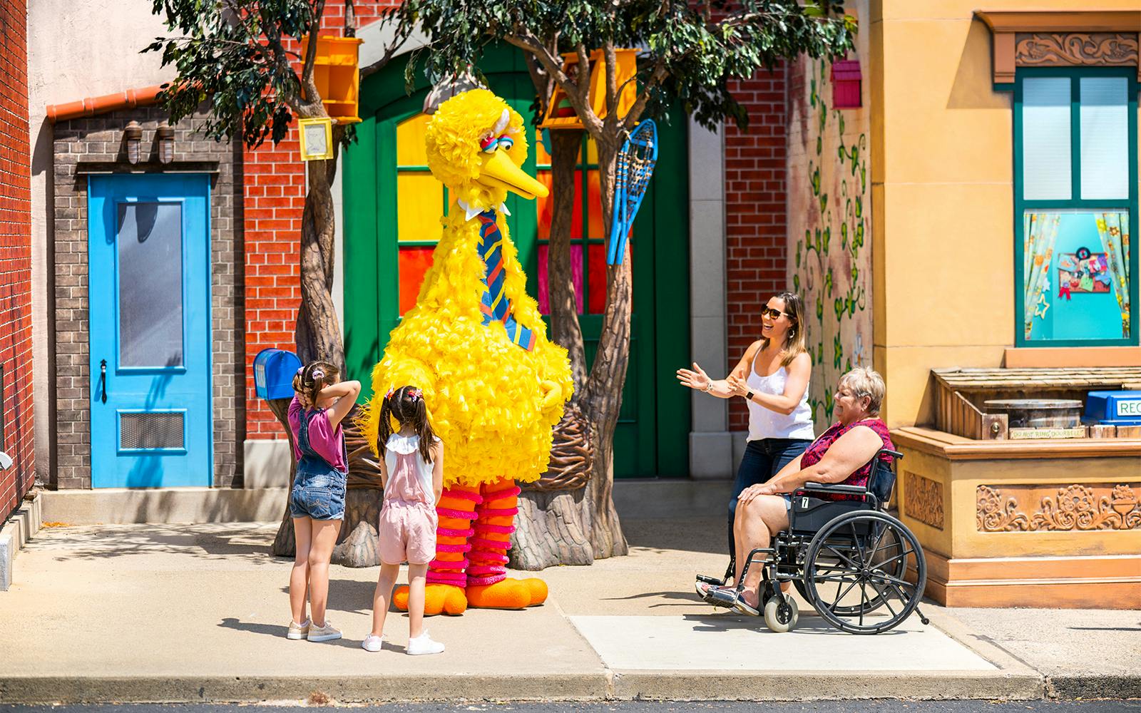 Visitors interacting with a character at Sesame Place Philadelphia.