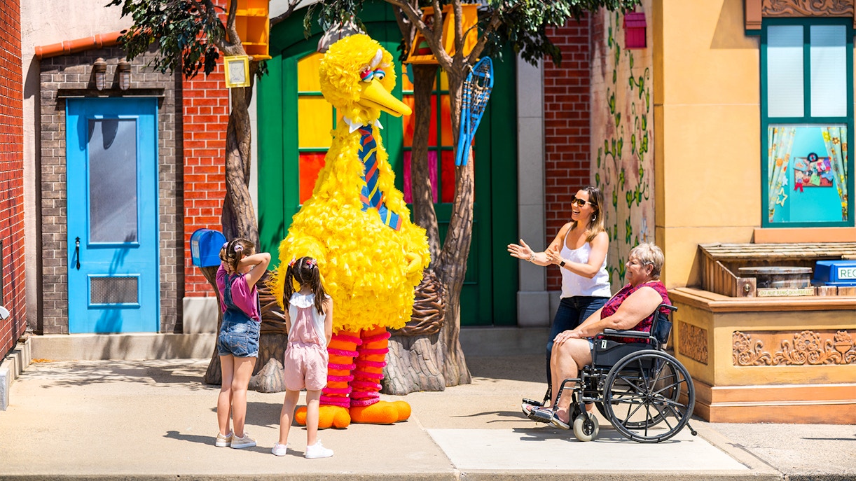 Visitors interacting with a character at Sesame Place Philadelphia.