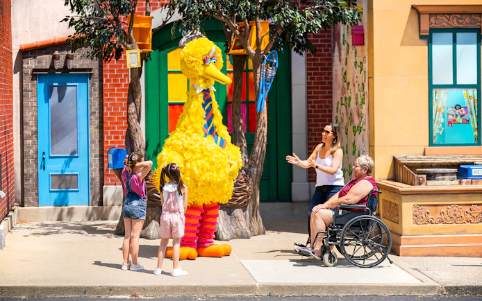 Visitors interacting with a character at Sesame Place Philadelphia.