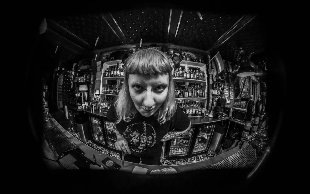 Bartender in Reykjavik punk bar during music history and Icelandic food tour.