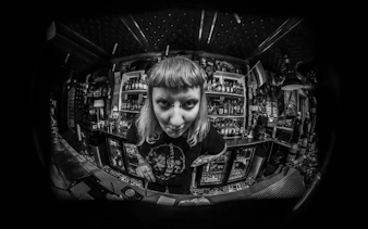 Bartender in Reykjavik punk bar during music history and Icelandic food tour.