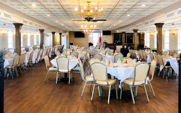 Dining area setup on Riverboat City of New Orleans sightseeing cruise.