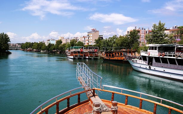 Manavgat River cruise boats docked near the Grand Bazaar, Turkey.