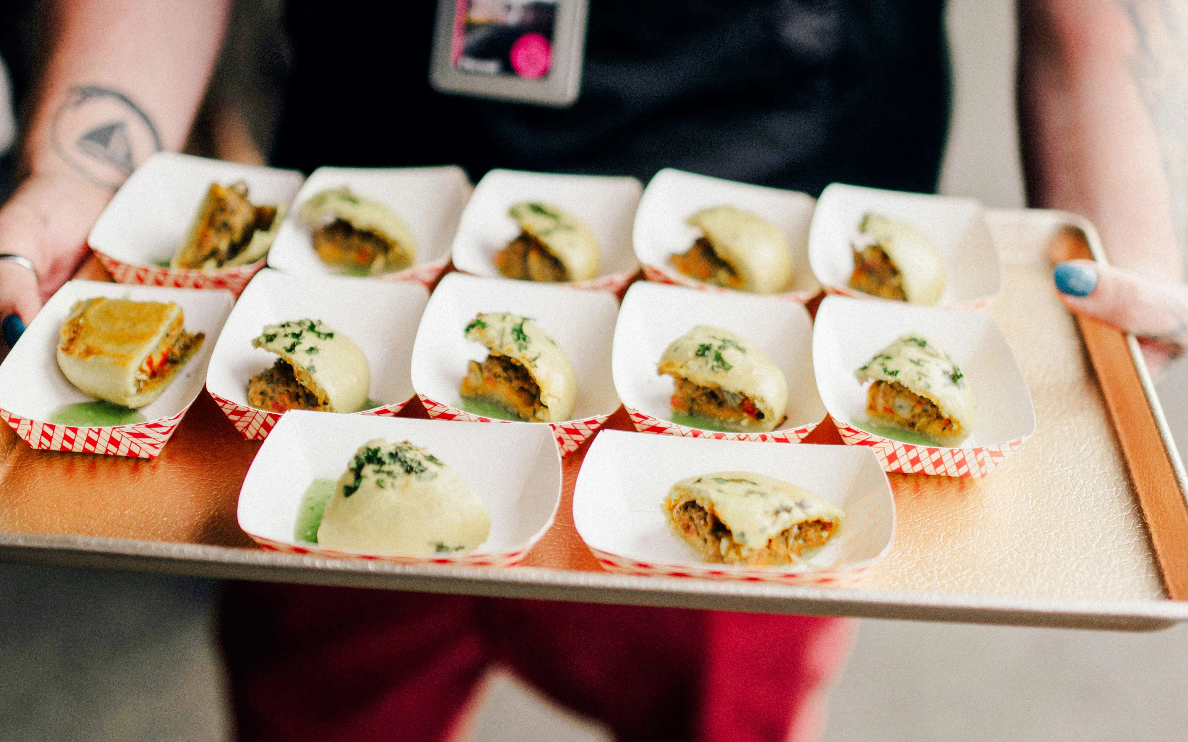 Assorted dumplings on a tray during a chef-guided food tour at Pike Place Market.