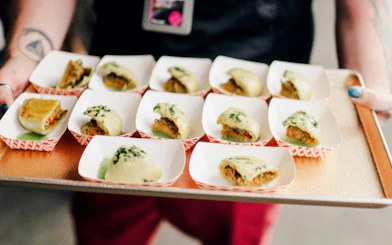 Assorted dumplings on a tray during a chef-guided food tour at Pike Place Market.