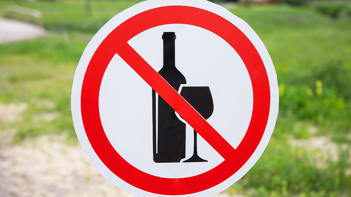 No alcohol sign with bottle and glass crossed out.