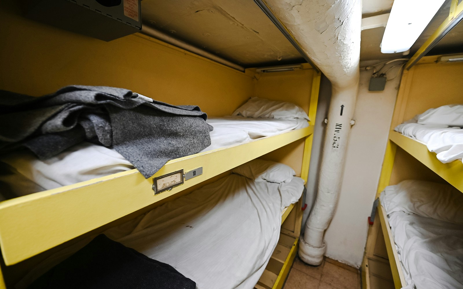 Bunk beds in a narrow cabin on an American World War Two battleship.