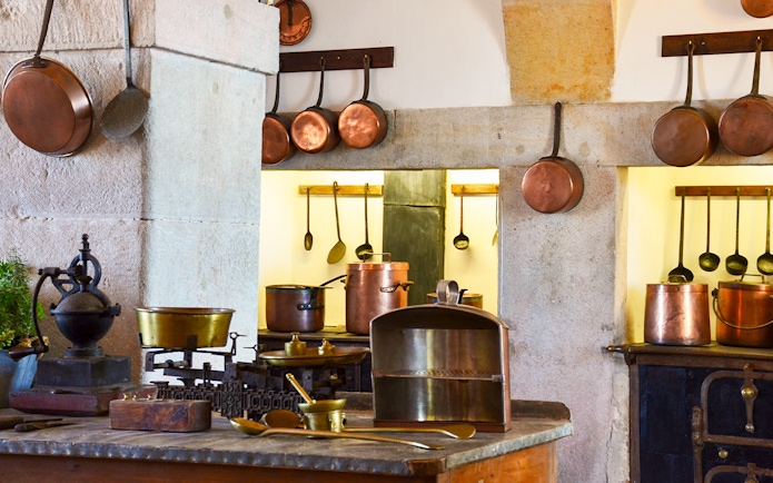 Copper cookware in the historic kitchen of the Royal Palace of Madrid.
