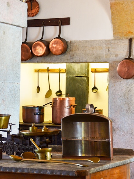 Copper cookware in the historic kitchen of the Royal Palace of Madrid.