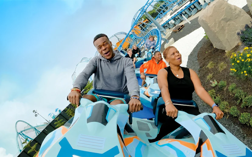 Visitors enjoying a roller coaster ride at SeaWorld San Diego.