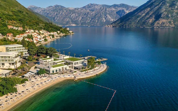Aerial view of Kotor Bay with mountains and coastline in Montenegro.