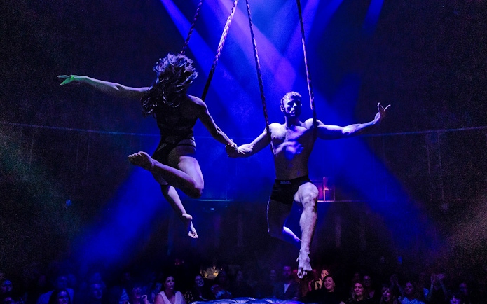 Performers on aerial ropes during Magic Mike Live show.