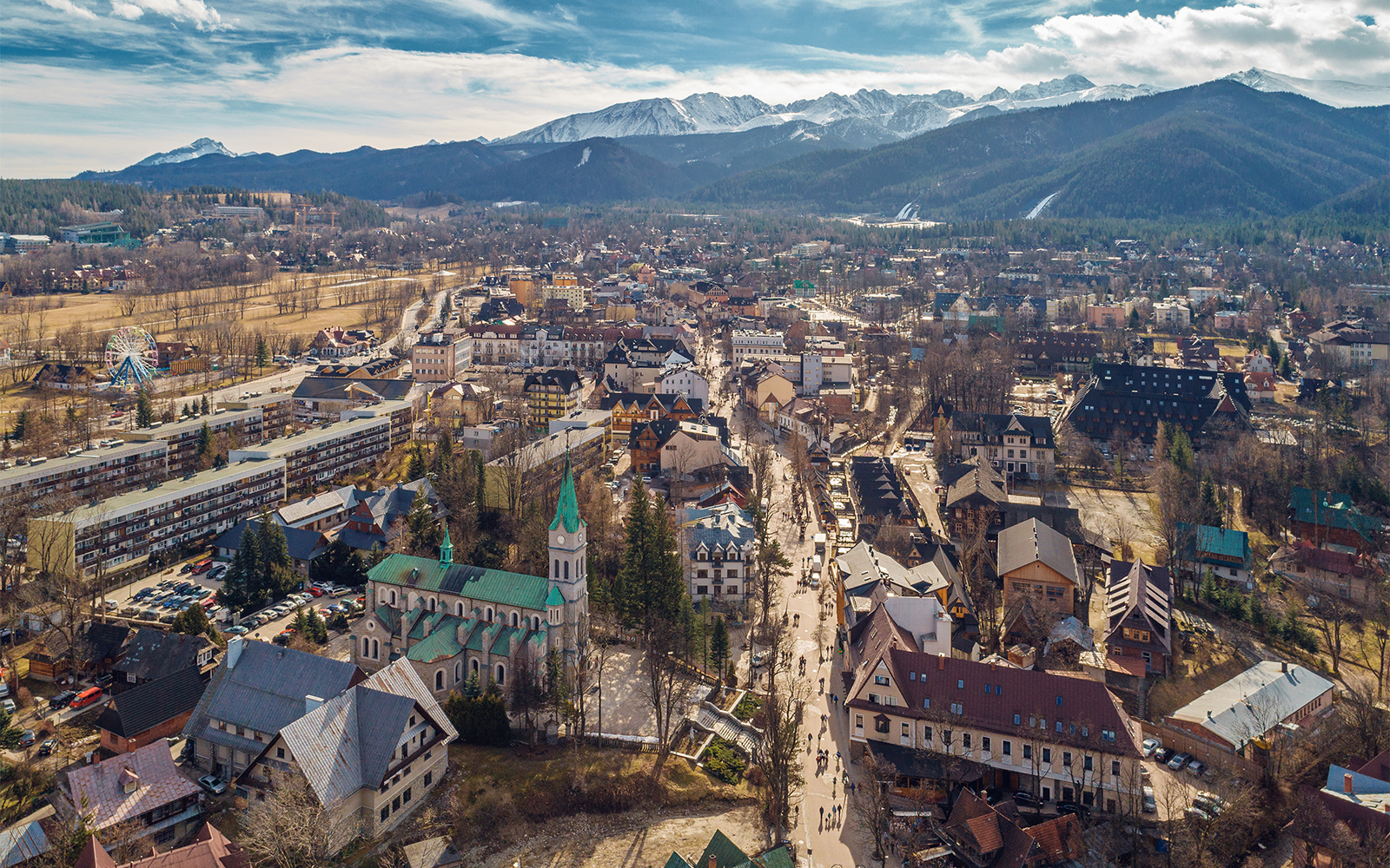 Aerial view of Zakopane with Tatra Mountains in the background, part of the Zakopane tour from Krakow.