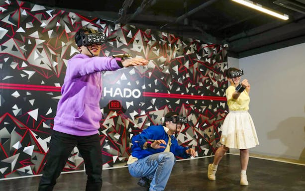Visitors playing augmented reality game at RED° TOKYO TOWER.