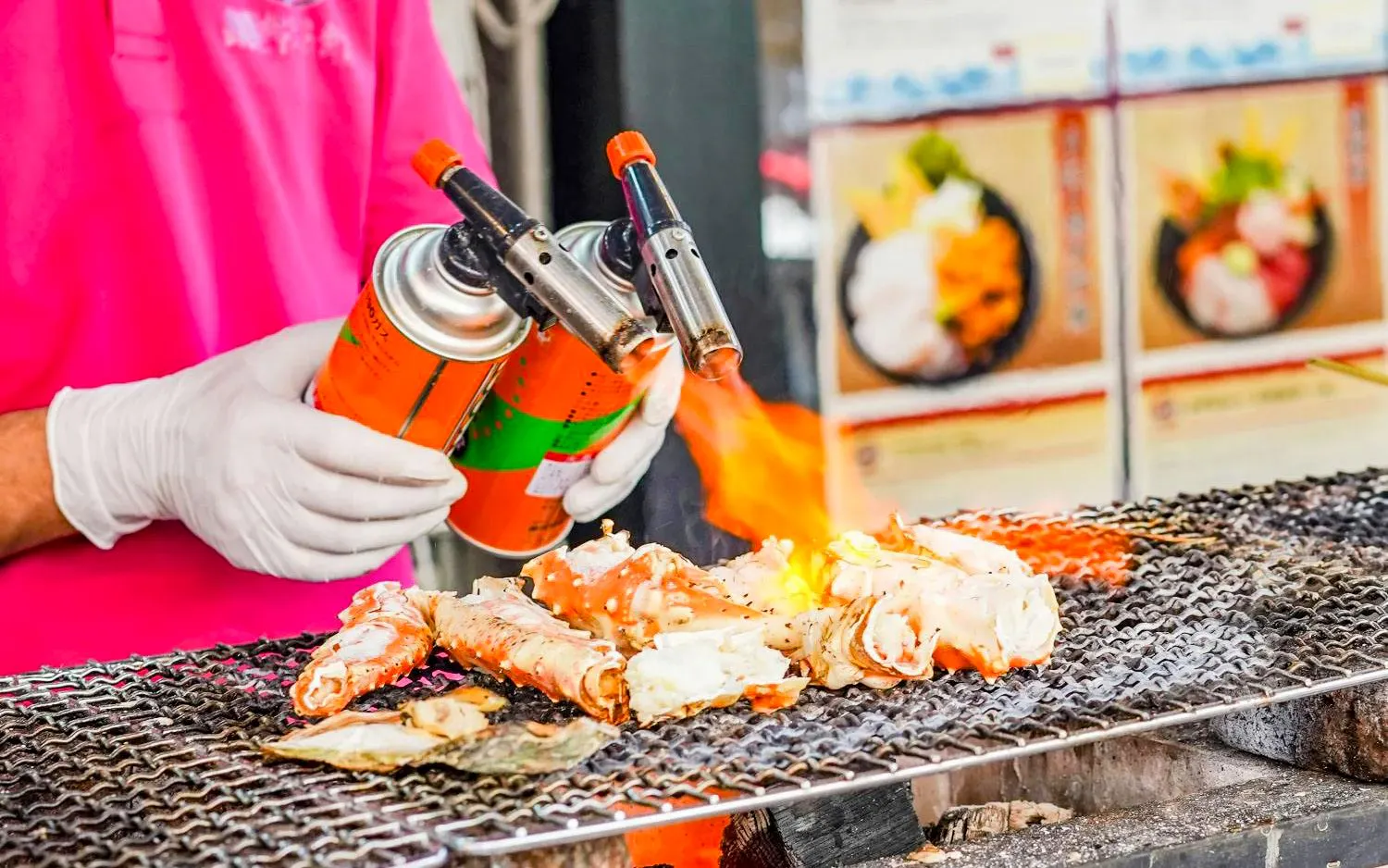 Grilled crabs being torched at Tsukiji Fish Market, Tokyo.