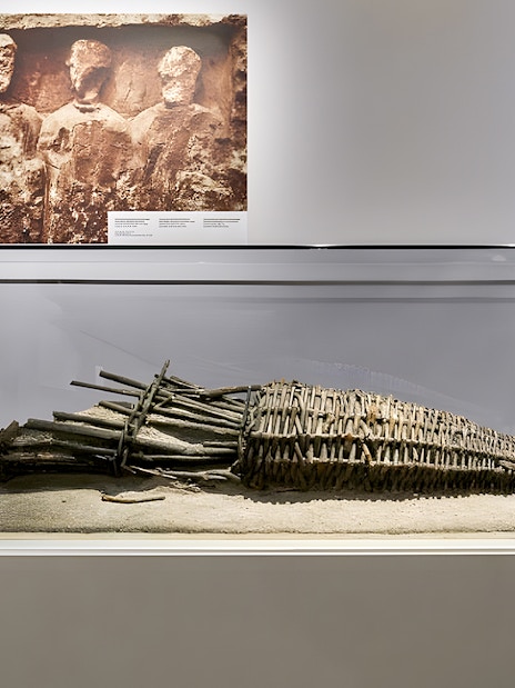 Medieval artifact displayed in Notre Dame Crypt, Paris exhibit.