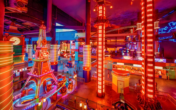 Genting Skytropolis Indoor Theme Park with vibrant neon lights and colorful rides.