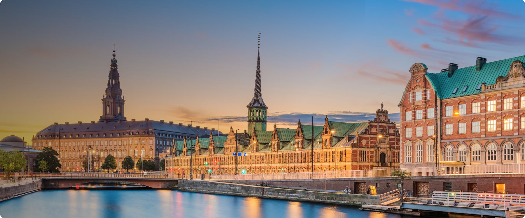 Historic buildings along the canal at sunset in Copenhagen, Denmark.