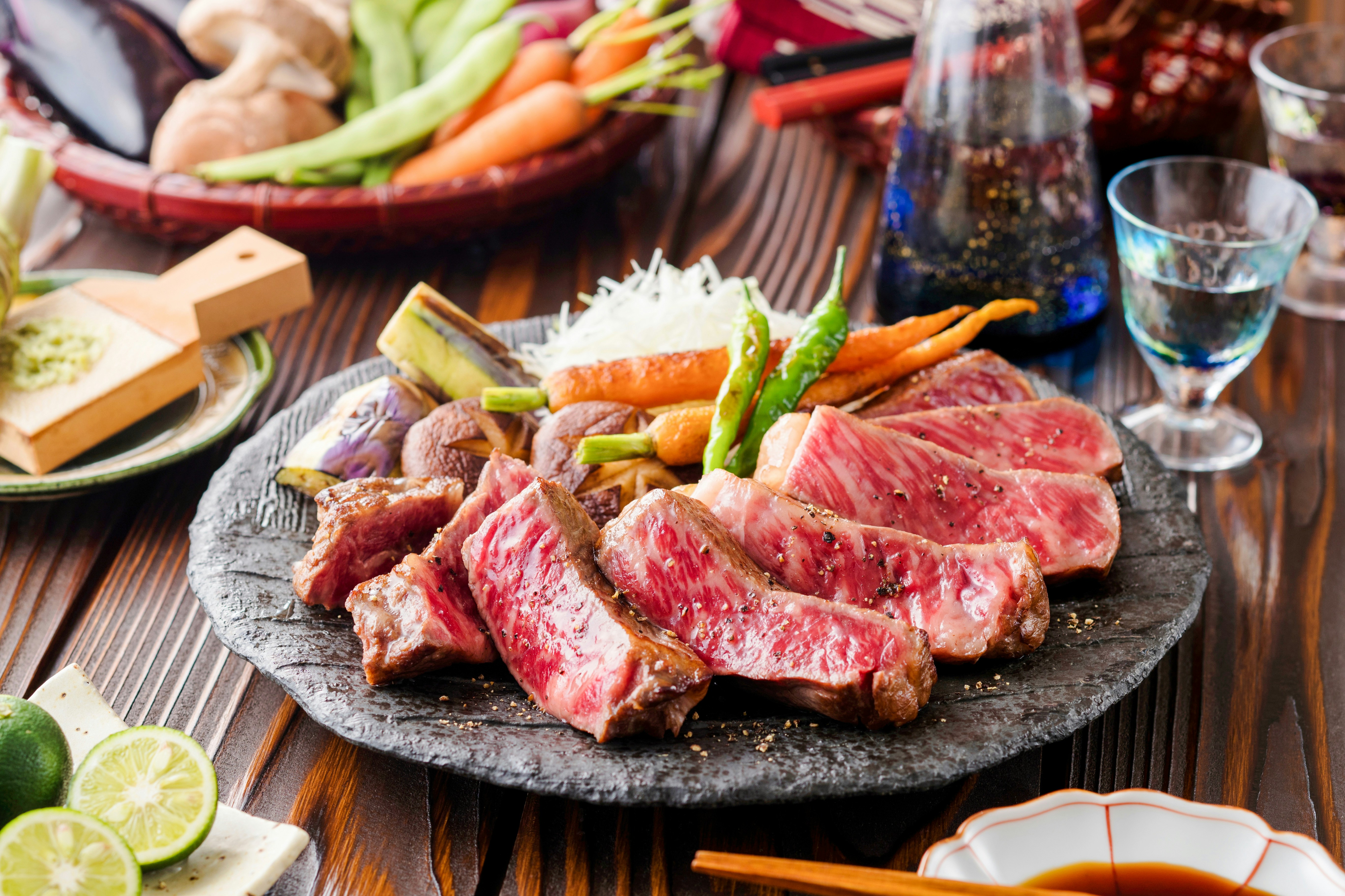 Wagyu steak served on a wooden board with garnish in a Tokyo restaurant.