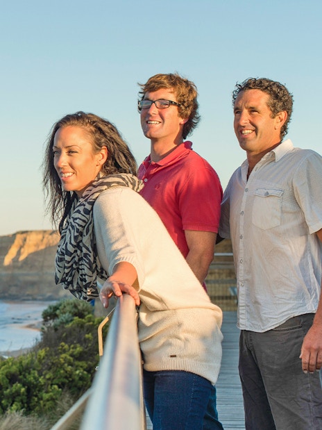 Tourists enjoying the view of the Twelve Apostles on the Great Ocean Road tour.