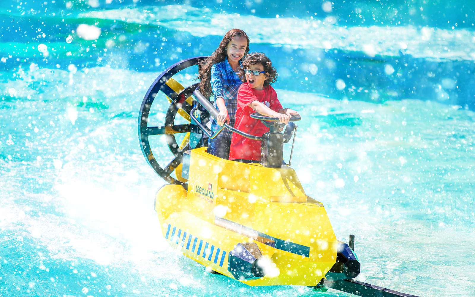 Children enjoying AquaZone Wave Racers ride at LEGOLAND Theme Park, Florida.