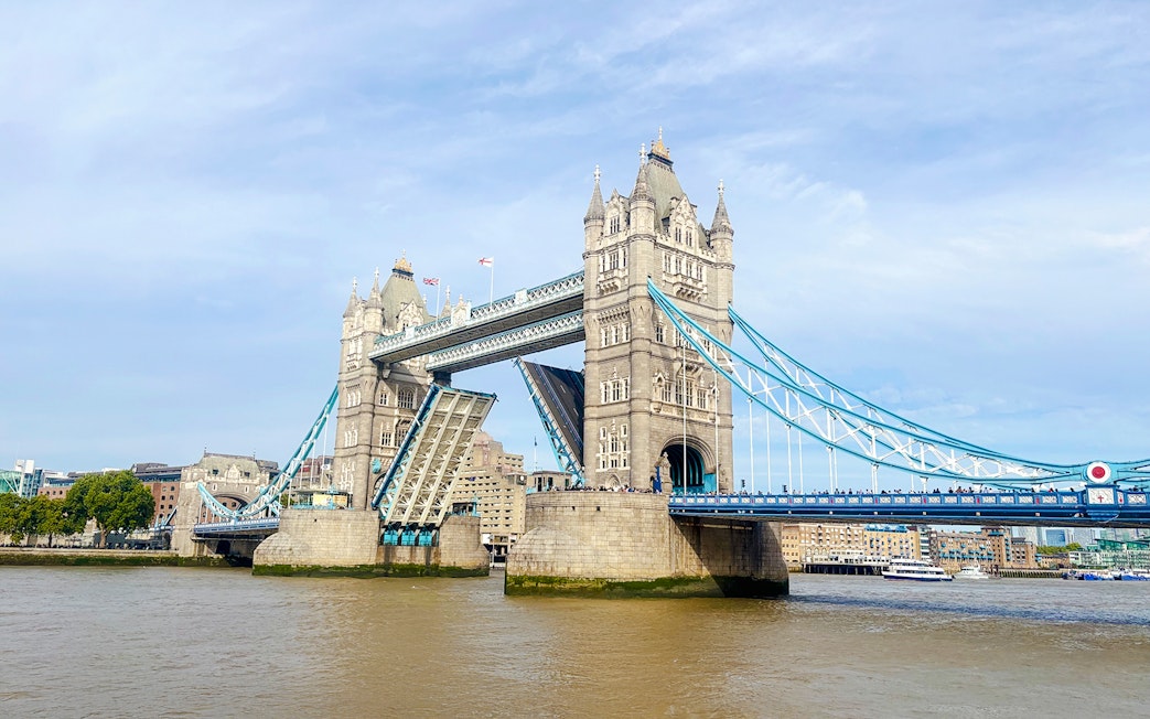 Tower Bridge in London with its bascules raised for a bridge lift.