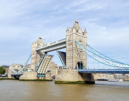 Tower Bridge in London with its bascules raised for a bridge lift.