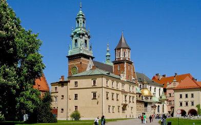 Wawel Cathedral exterior with tourists in Krakow, Poland.
