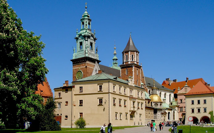 Wawel Cathedral exterior with tourists in Krakow, Poland.