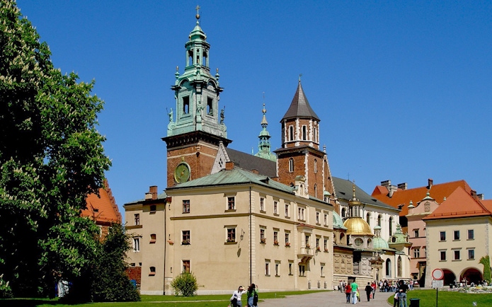 Wawel Cathedral exterior with tourists in Krakow, Poland.