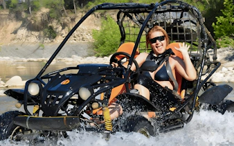 Buggy crossing a river during Alanya Buggy Safari tour in Turkey.