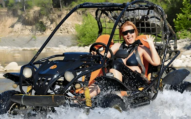Buggy crossing a river during Alanya Buggy Safari tour in Turkey.