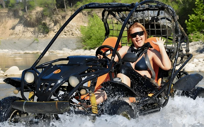 Buggy crossing a river during Alanya Buggy Safari tour in Turkey.
