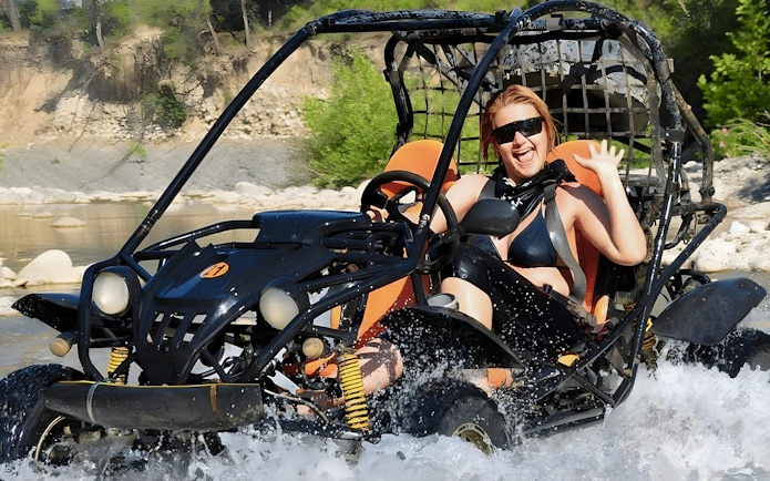 Buggy crossing a river during Alanya Buggy Safari tour in Turkey.