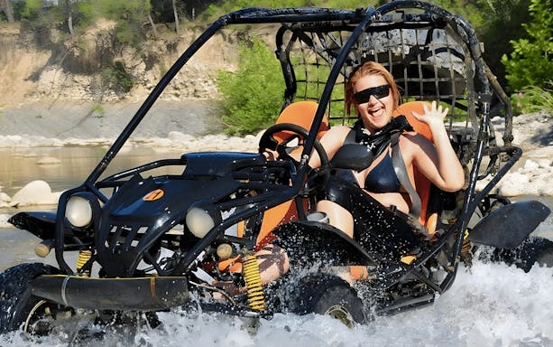 Buggy crossing a river during Alanya Buggy Safari tour in Turkey.