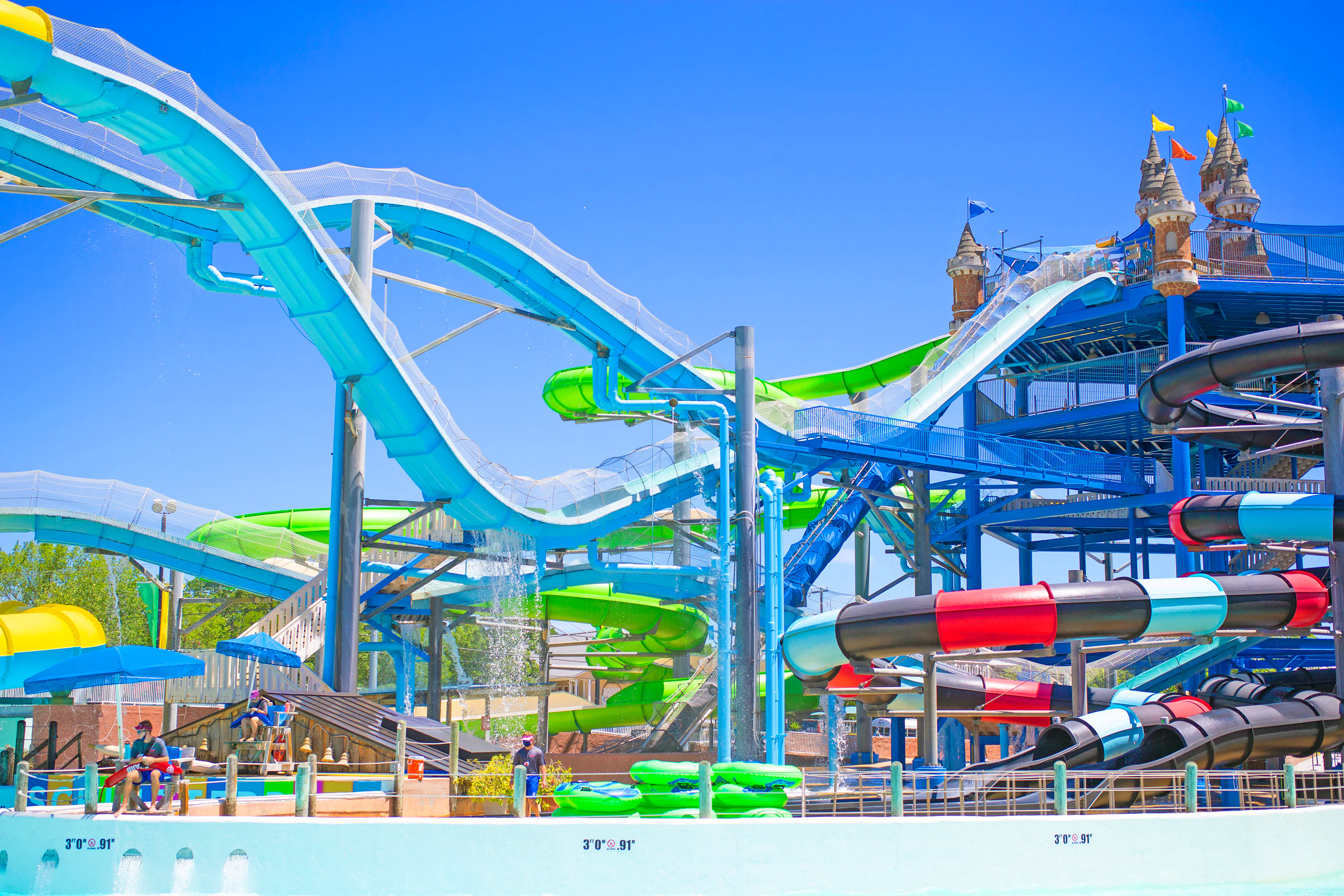 Water slides at Master Blaster, Schlitterbahn New Braunfels, with colorful tubes and towers.