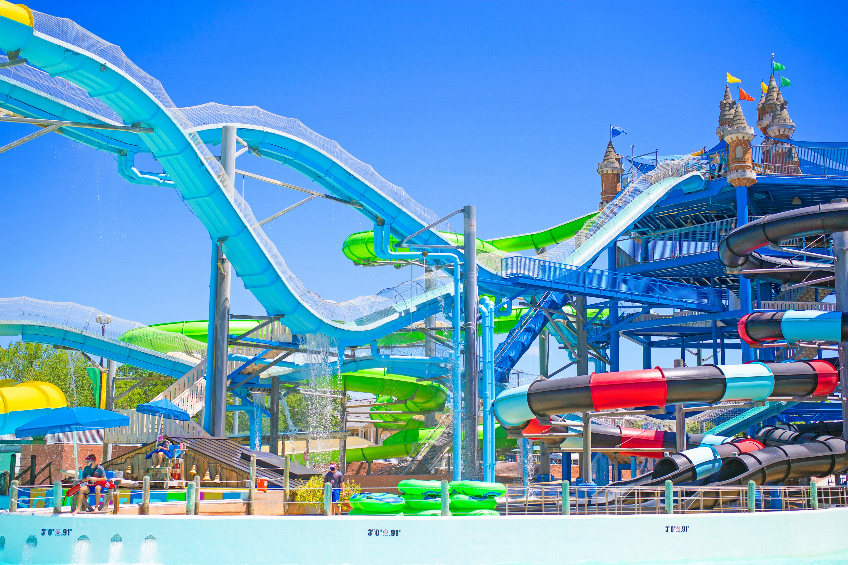 Water slides at Master Blaster, Schlitterbahn New Braunfels, with colorful tubes and towers.
