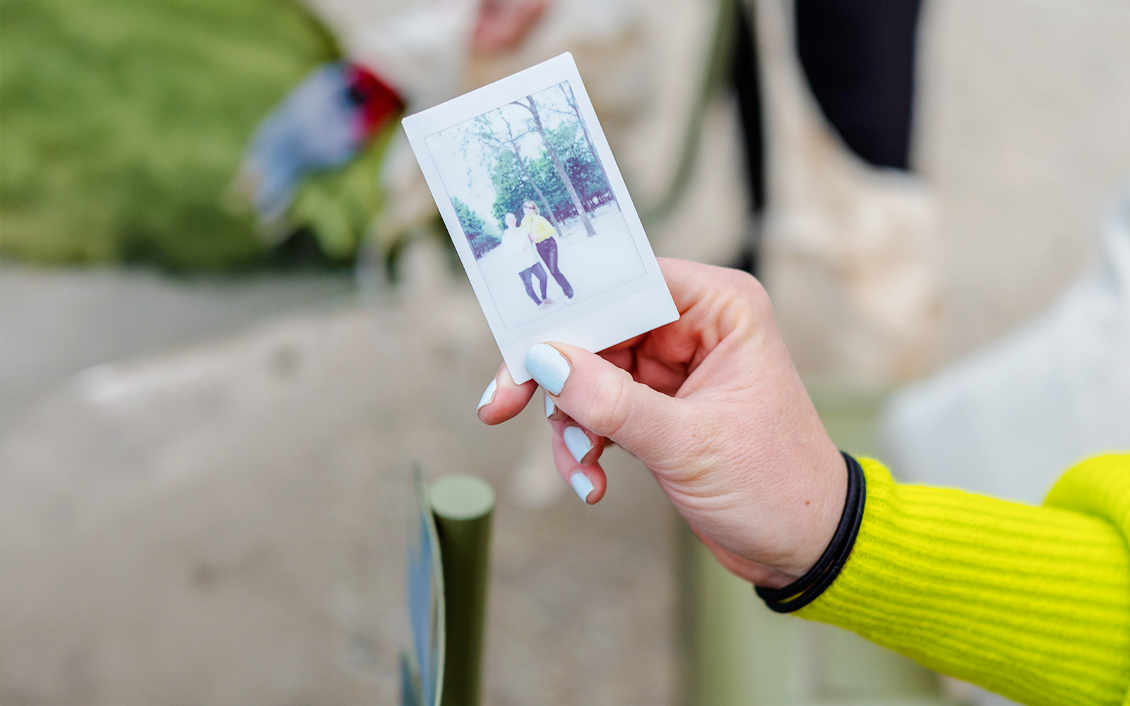 Person holding a polaroid during Emily in Paris Food Tour.