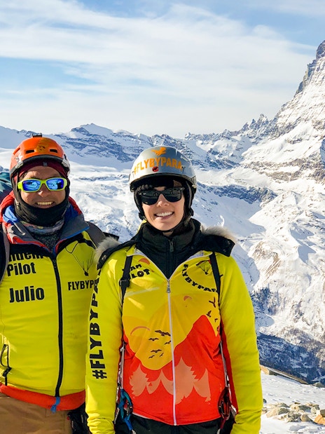 Tourist with guide on Zermatt mountain, Matterhorn in background.