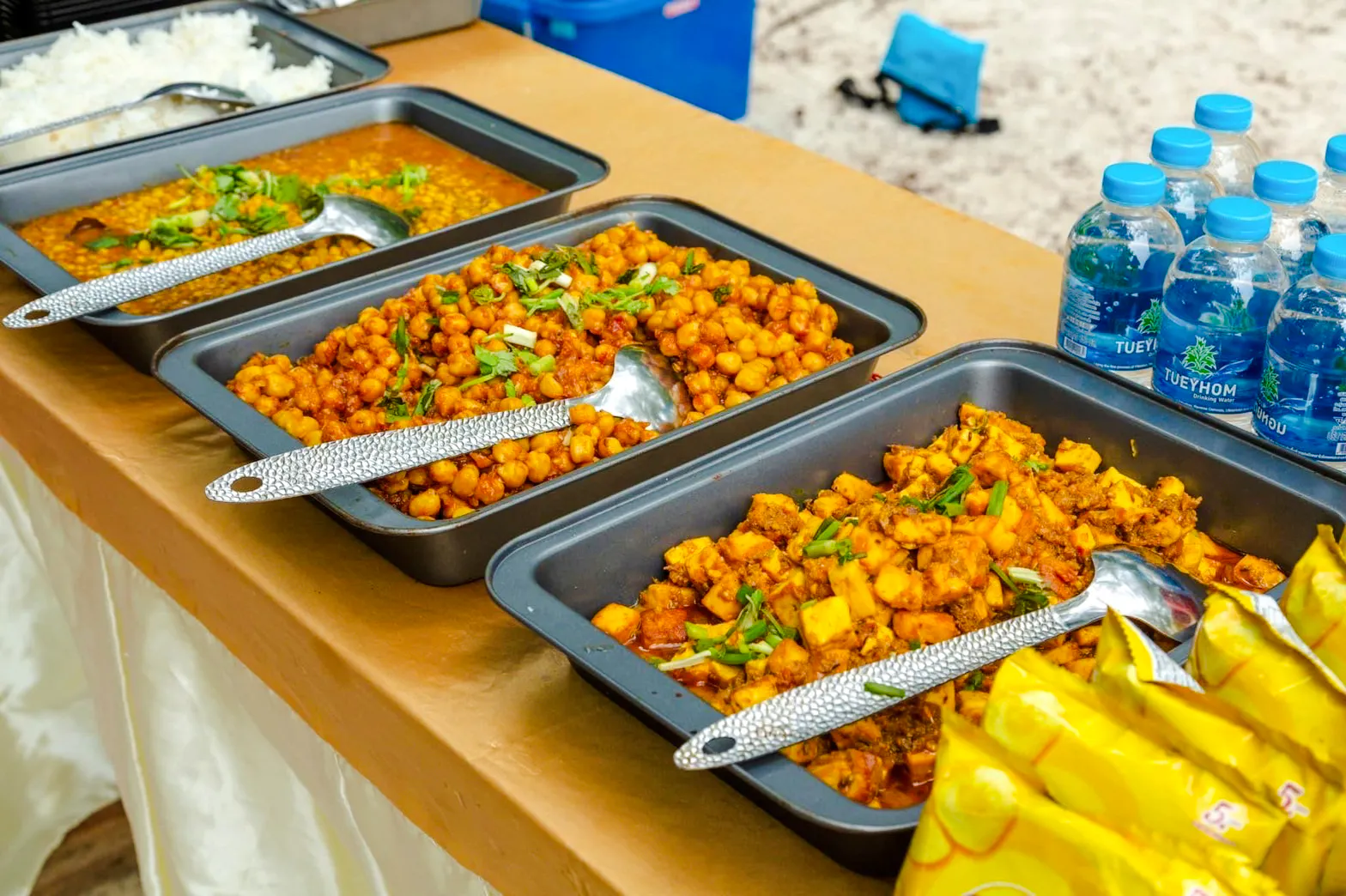 Buffet spread with chickpea curry and rice on Krabi Hong Islands sunset tour.