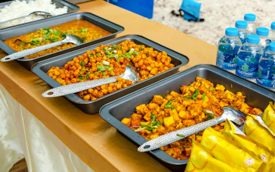 Buffet spread with chickpea curry and rice on Krabi Hong Islands sunset tour.