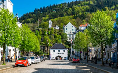 Lower station of the Fløibanen funicular in Bergen, Norway, with surrounding buildings and greenery.