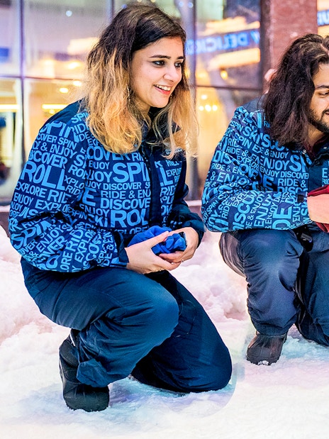 Visitors interacting with penguins at Ski Dubai Penguin Encounter.