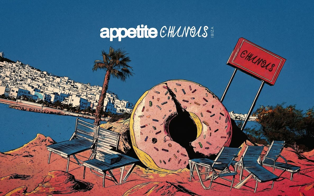 Chairs and giant donut sculpture on Ibiza beach near Chinois restaurant.