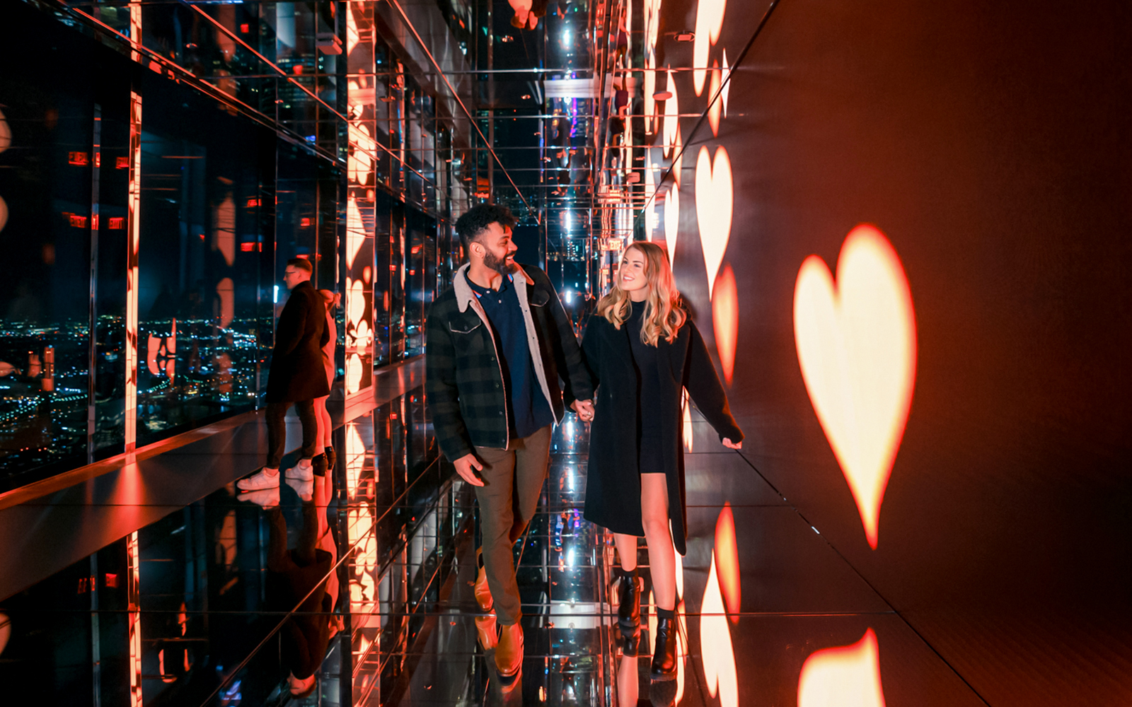 Couple enjoying panoramic view from Summit One Vanderbilt, New York City, on Valentine's Day.