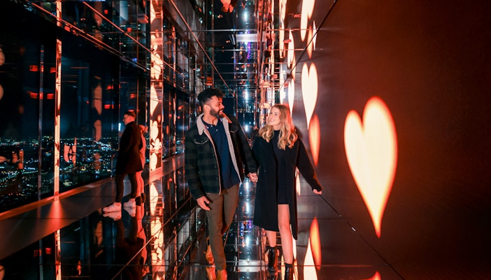 Couple enjoying panoramic view from Summit One Vanderbilt, New York City, on Valentine's Day.