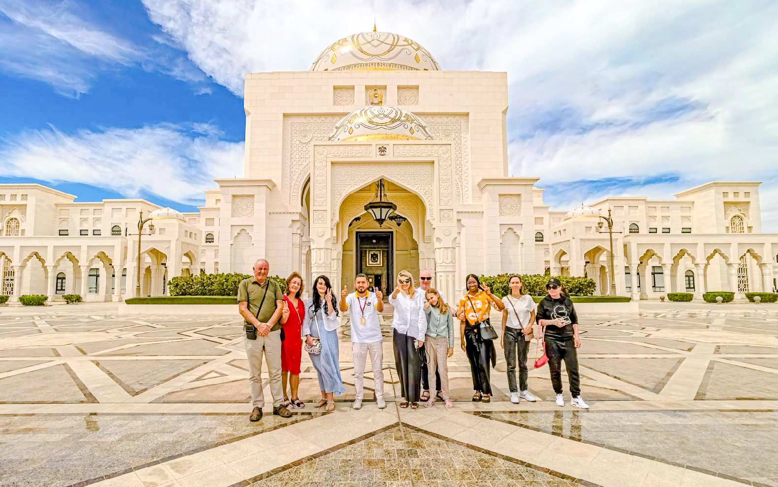 Tour group with guide at Qasr Al Watan entrance, Abu Dhabi.