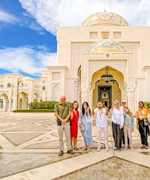 Tour group with guide at Qasr Al Watan entrance, Abu Dhabi.