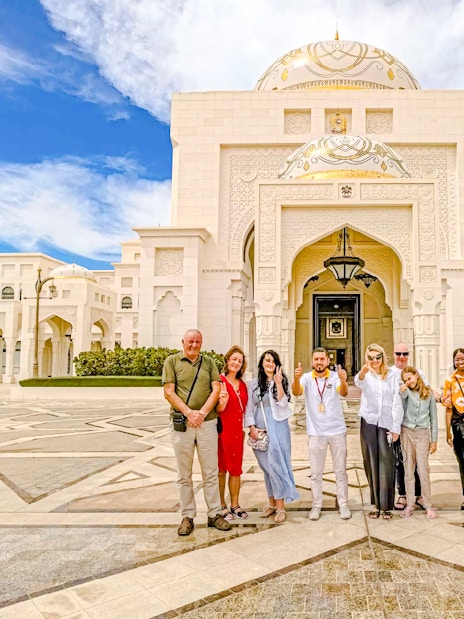 Tour group with guide at Qasr Al Watan entrance, Abu Dhabi.