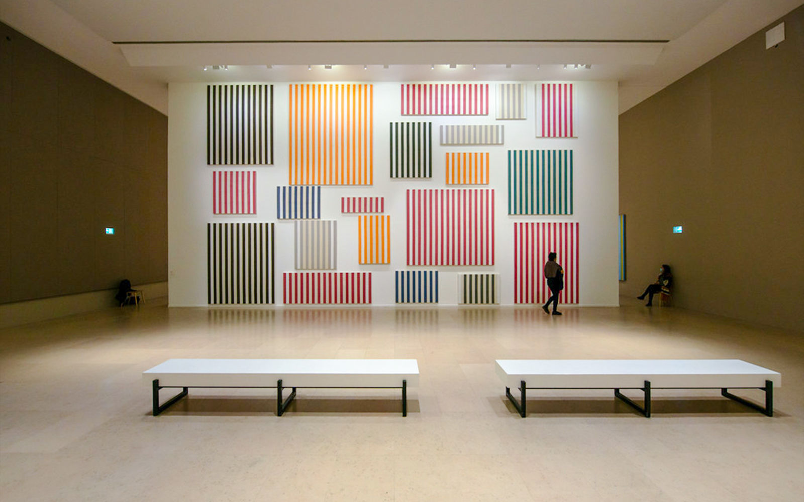 Striped artwork display inside Museum of Modern Art exhibit hall.